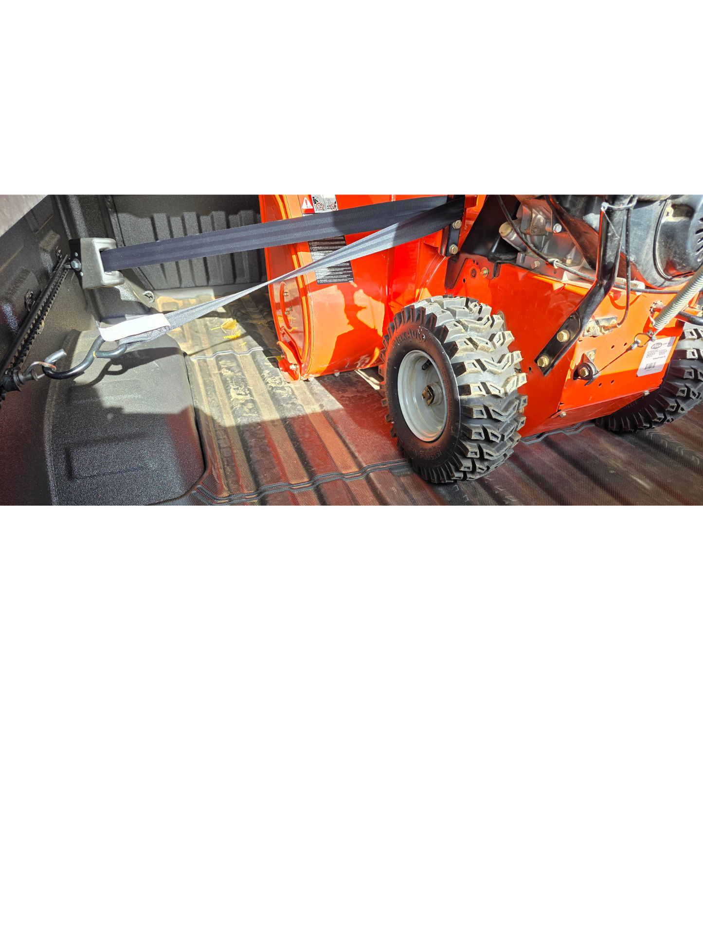 Truck bed tie down system