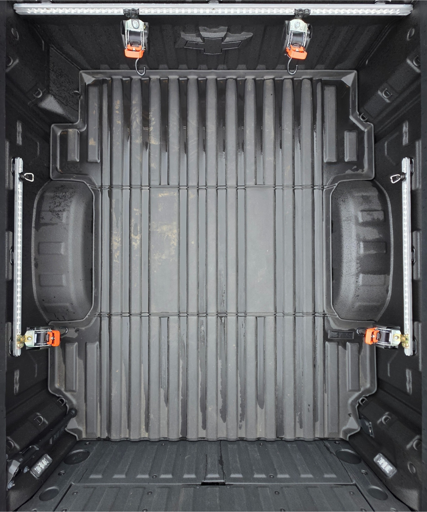 Truck bed tie down system